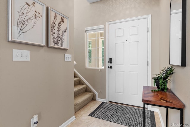 15125 E Bayaud Pl, Aurora, CO 80012 - foyer featuring stairs and tile patterned floors