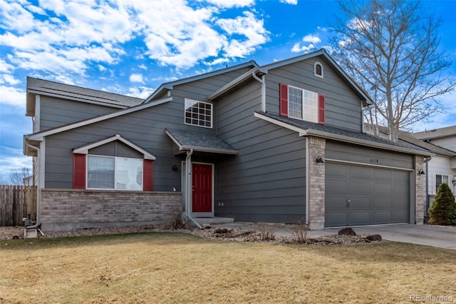 traditional home featuring a garage, brick siding, fence, concrete driveway, and a front yard