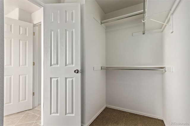 spacious closet featuring tile patterned floors