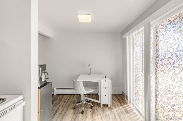 7100 Stuart St, Westminster, CO 80030 - office with wood finished floors and a baseboard radiator