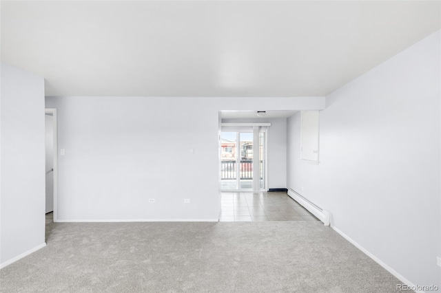 7100 Stuart St, Westminster, CO 80030 - unfurnished room featuring a baseboard heating unit and carpet flooring