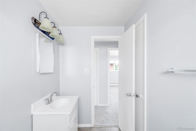 7100 Stuart St, Westminster, CO 80030 - bathroom with vanity and a baseboard radiator
