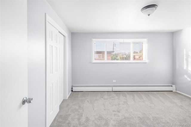 7100 Stuart St, Westminster, CO 80030 - unfurnished bedroom with a baseboard heating unit, carpet, and a closet
