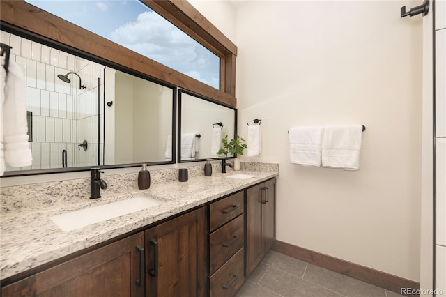 166 Hay Meadow Dr, Fraser, CO 80442 - full bath featuring double vanity, tile patterned floors, baseboards, and a stall shower