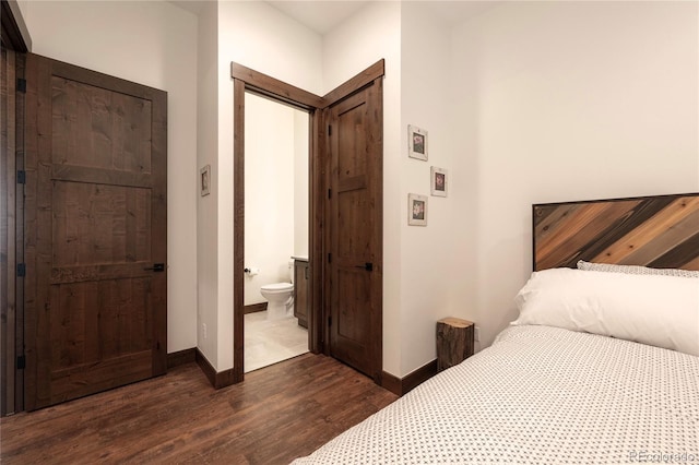 166 Hay Meadow Dr, Fraser, CO 80442 - bedroom with dark wood-style floors, baseboards, and connected bathroom