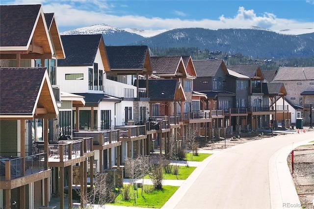166 Hay Meadow Dr, Fraser, CO 80442 - view of asphalt road with a mountain view, a residential view, and curbs