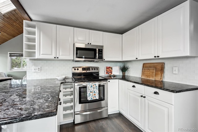 kitchen featuring tasteful backsplash, appliances with stainless steel finishes, dark wood-type flooring, and white cabinets