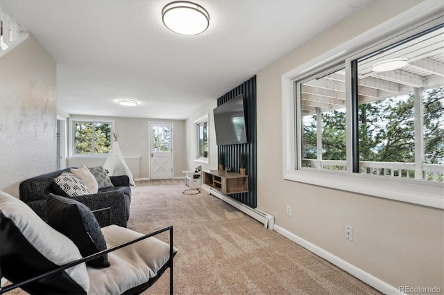 living room featuring baseboard heating and light colored carpet