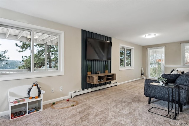 sitting room with light colored carpet and baseboard heating