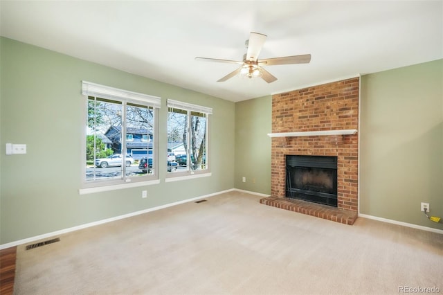 15660 E Purdue Dr, Aurora, CO 80013 - unfurnished living room featuring baseboards, visible vents, a fireplace, and ceiling fan