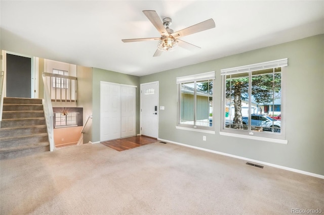 15660 E Purdue Dr, Aurora, CO 80013 - entrance foyer featuring visible vents, baseboards, carpet, and ceiling fan