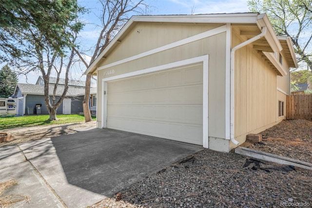 15660 E Purdue Dr, Aurora, CO 80013 - garage with fence and concrete driveway