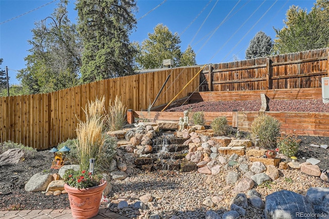 view of yard with a fenced backyard