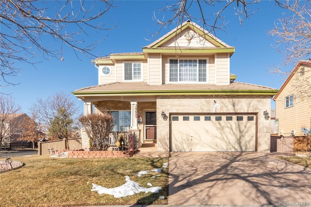 view of front of home with a garage, a front lawn, and a porch