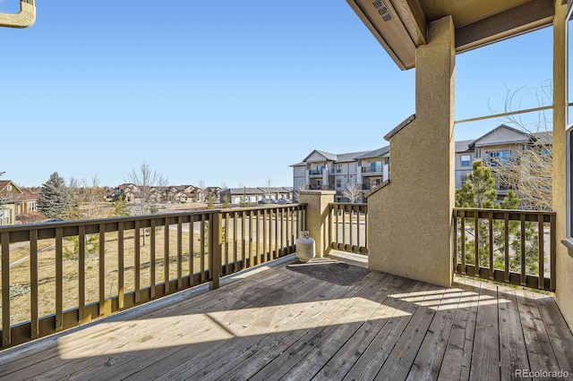 wooden deck featuring a residential view