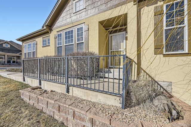 view of side of property featuring stucco siding