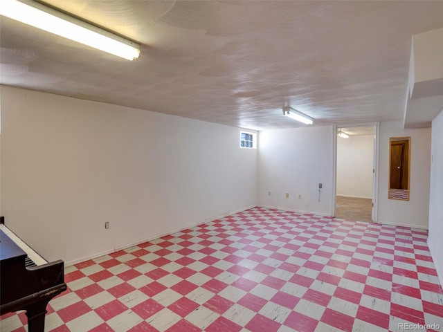 basement featuring light floors