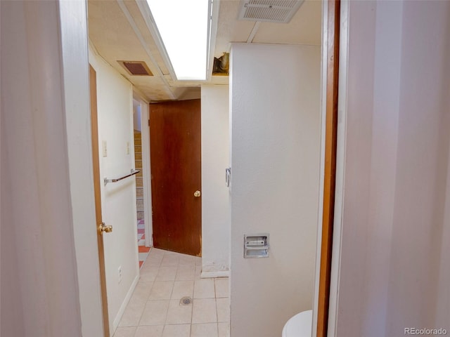 bathroom featuring toilet, visible vents, and tile patterned floors