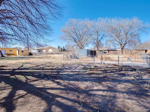 exterior space with a gate and fence