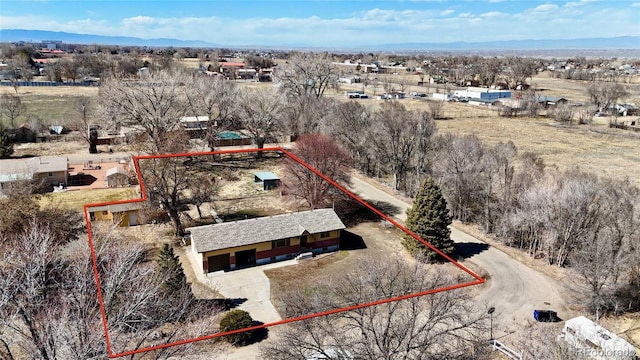 birds eye view of property featuring a rural view and a mountain view