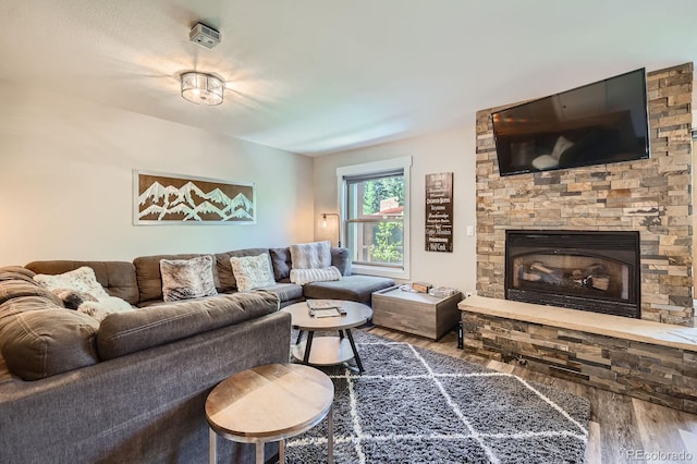 815 Columbine Rd Unit 22, Breckenridge, CO 80424 - living area featuring wood finished floors and a stone fireplace