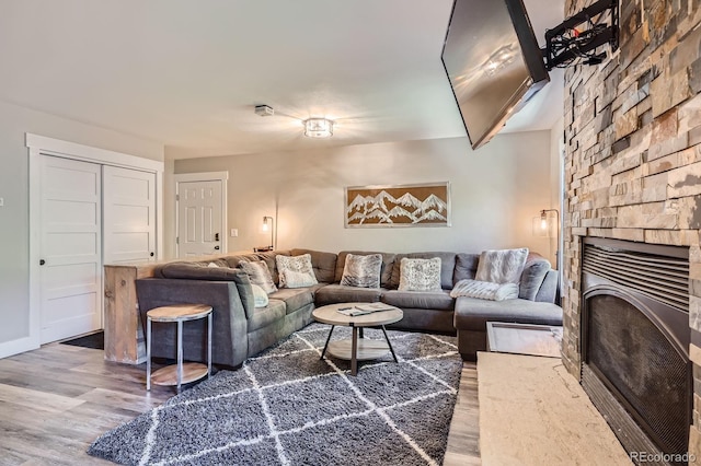 815 Columbine Rd Unit 22, Breckenridge, CO 80424 - living room featuring wood finished floors and a fireplace