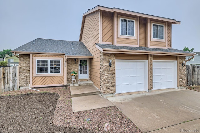 3455 Sun River Pl, Colorado Springs, CO 80920 - view of front of property with stone siding, driveway, an attached garage, and roof with shingles