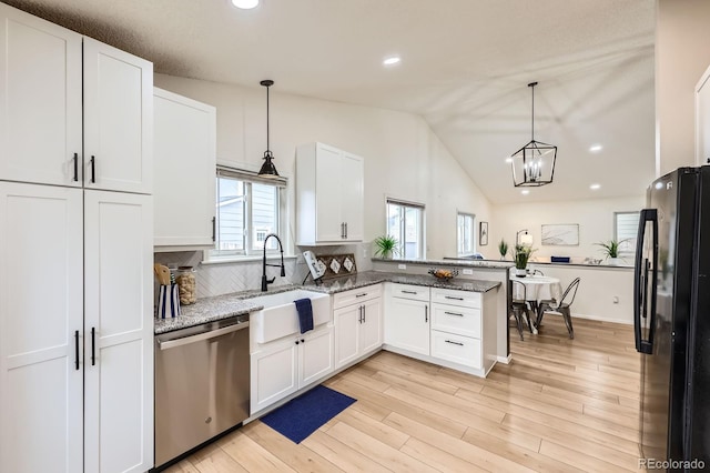 3455 Sun River Pl, Colorado Springs, CO 80920 - kitchen featuring freestanding refrigerator, stainless steel dishwasher, a sink, white cabinets, and recessed lighting