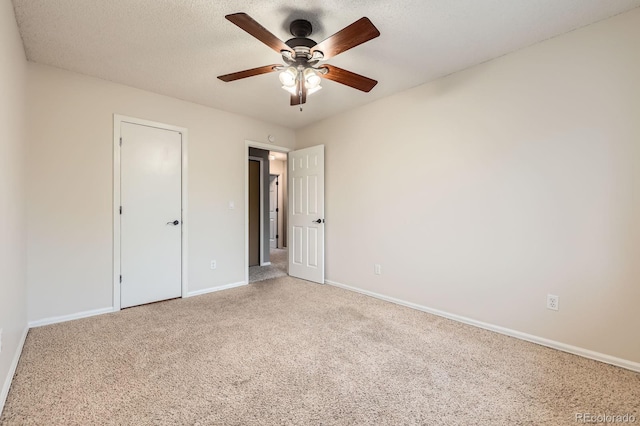3455 Sun River Pl, Colorado Springs, CO 80920 - unfurnished bedroom with carpet flooring, baseboards, a ceiling fan, and a textured ceiling