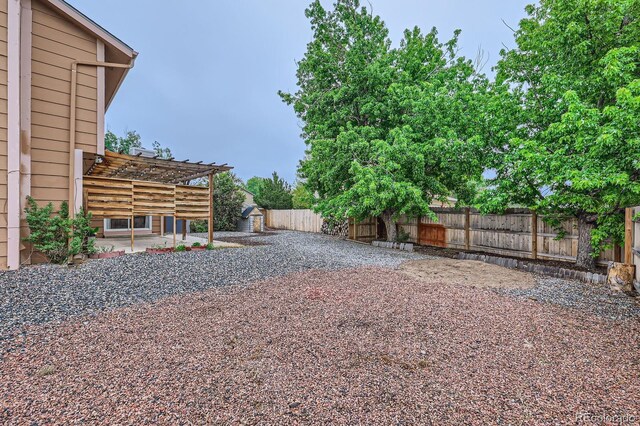 3455 Sun River Pl, Colorado Springs, CO 80920 - fenced backyard with a patio area and a pergola