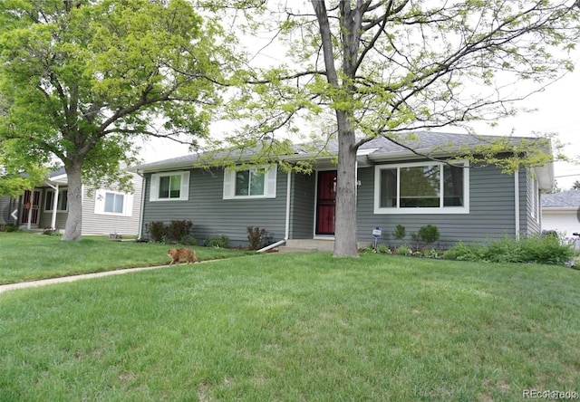 ranch-style home featuring a front yard