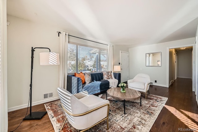 living room with dark hardwood / wood-style floors