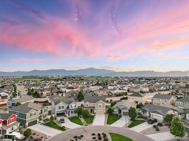8308 Needle Drop Ct, Colorado Springs, CO 80908 - aerial view at dusk of a residential view and a mountain view