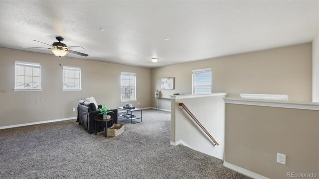 8308 Needle Drop Ct, Colorado Springs, CO 80908 - sitting room featuring an upstairs landing, carpet, and a ceiling fan