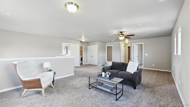 8308 Needle Drop Ct, Colorado Springs, CO 80908 - living area featuring carpet floors, washer / clothes dryer, and a ceiling fan
