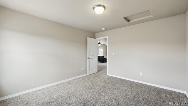 8308 Needle Drop Ct, Colorado Springs, CO 80908 - spare room with attic access and carpet flooring