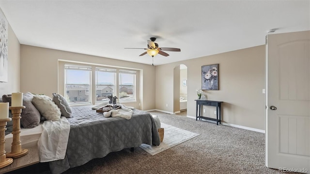 8308 Needle Drop Ct, Colorado Springs, CO 80908 - bedroom featuring carpet, arched walkways, and ceiling fan