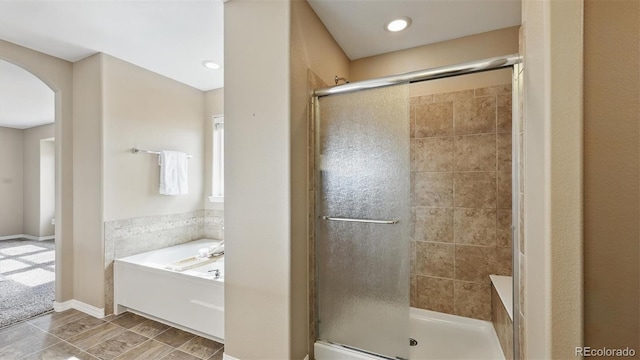 8308 Needle Drop Ct, Colorado Springs, CO 80908 - bathroom with a stall shower and a bath