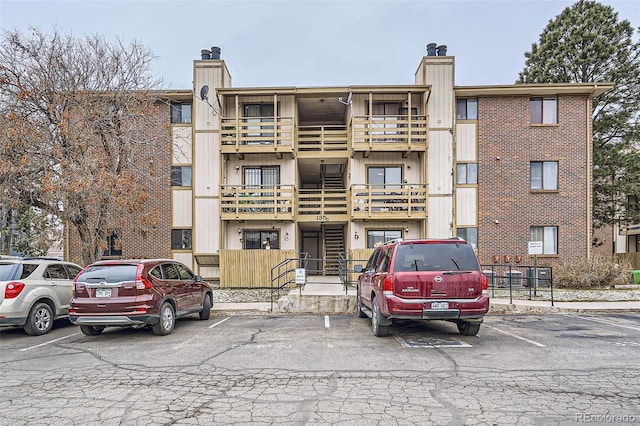 view of property featuring uncovered parking