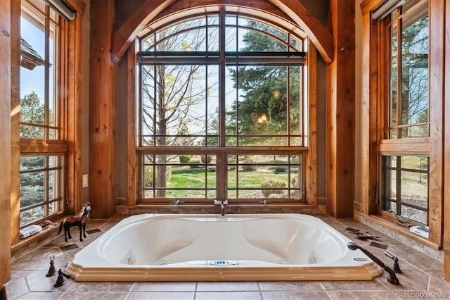 bathroom featuring tiled tub