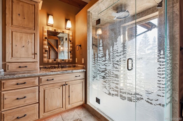 bathroom featuring vanity, an enclosed shower, and tile patterned floors