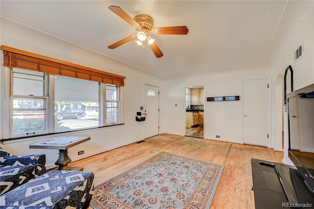 4130 S Elati St, Englewood, CO 80110 - living area featuring light wood-style floors and a ceiling fan
