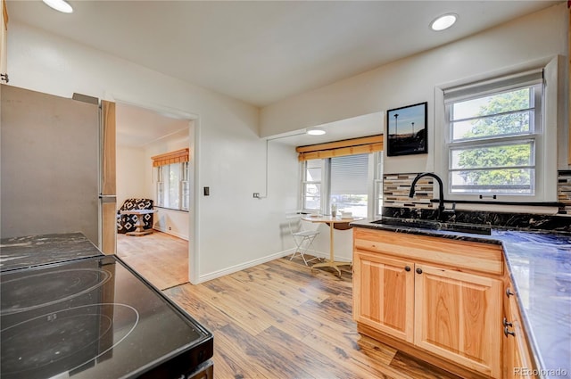 4130 S Elati St, Englewood, CO 80110 - kitchen featuring black electric range, freestanding refrigerator, light wood-type flooring, plenty of natural light, and recessed lighting