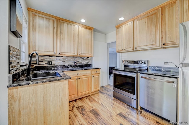 4130 S Elati St, Englewood, CO 80110 - kitchen featuring light brown cabinets, stainless steel appliances, light wood-style flooring, recessed lighting, and backsplash