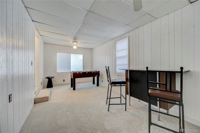 4130 S Elati St, Englewood, CO 80110 - rec room featuring ceiling fan, carpet flooring, a paneled ceiling, and wood walls