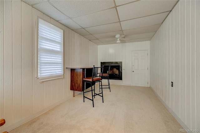 4130 S Elati St, Englewood, CO 80110 - kitchen with a ceiling fan, carpet floors, a fireplace, a paneled ceiling, and a breakfast bar area