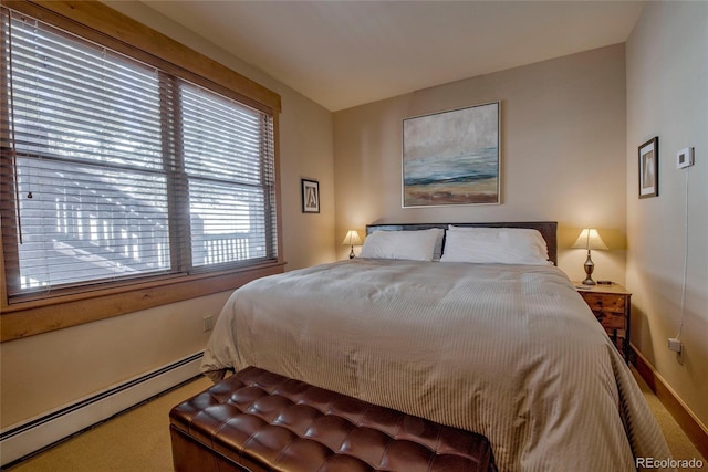 bedroom with carpet flooring and a baseboard radiator