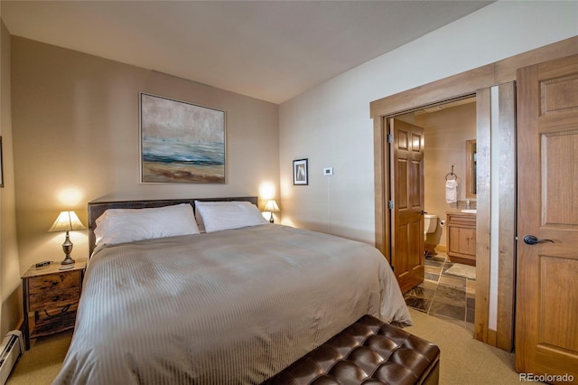 bedroom featuring carpet flooring, ensuite bathroom, and baseboard heating