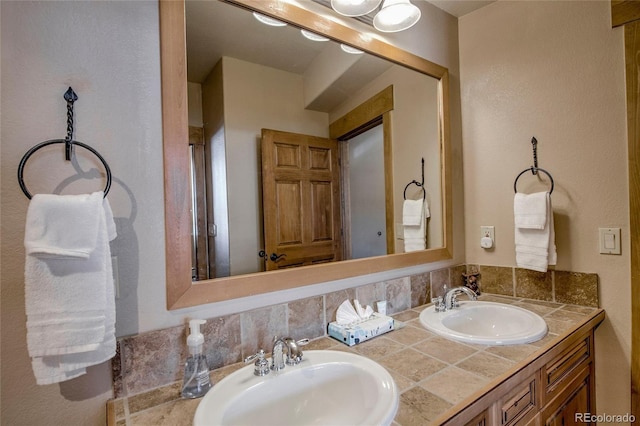 bathroom with backsplash and vanity