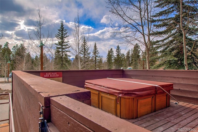 wooden terrace with a hot tub